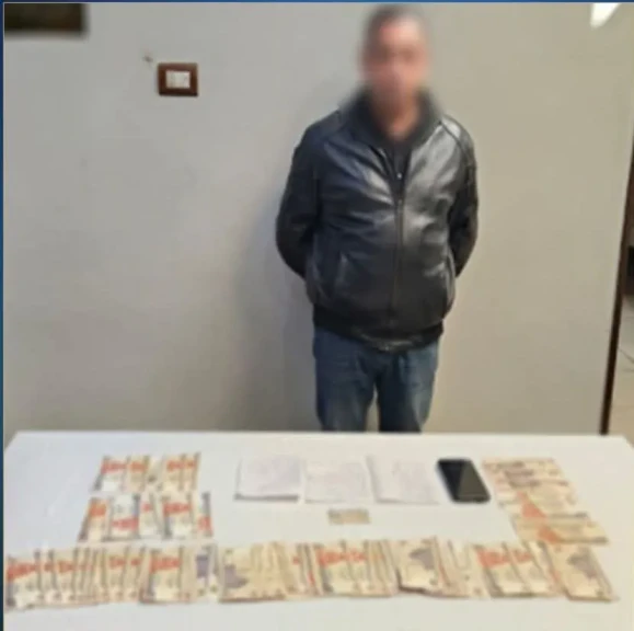 الداخلية:ضبط أحد الأشخاص لقيامه بتوزيع مبالغ مالية علي الناخبين بأسيوط